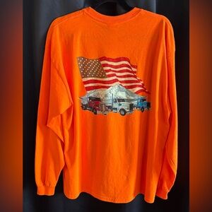 Men's extra large bright orange long-sleeve tee with trucks & flag on the back.